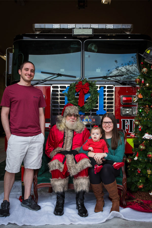 Family of 3 with Santa.